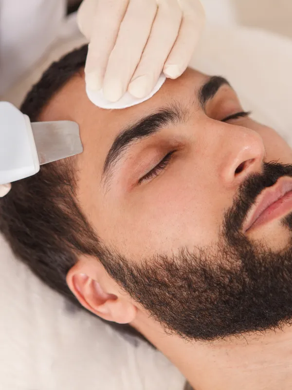 Professional Men's De-Tan Service at Tula Unisex Salon and Spa Siruseri